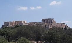 The ruins of the Acropolis at Athens, on the hill with blue sky above